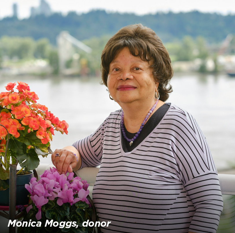 Monica Moggs, a legacy donor to Royal Columbian Hospital Foundation, standing next to some flowers
