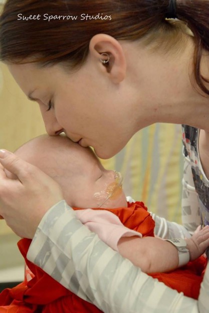 Mom and baby kiss